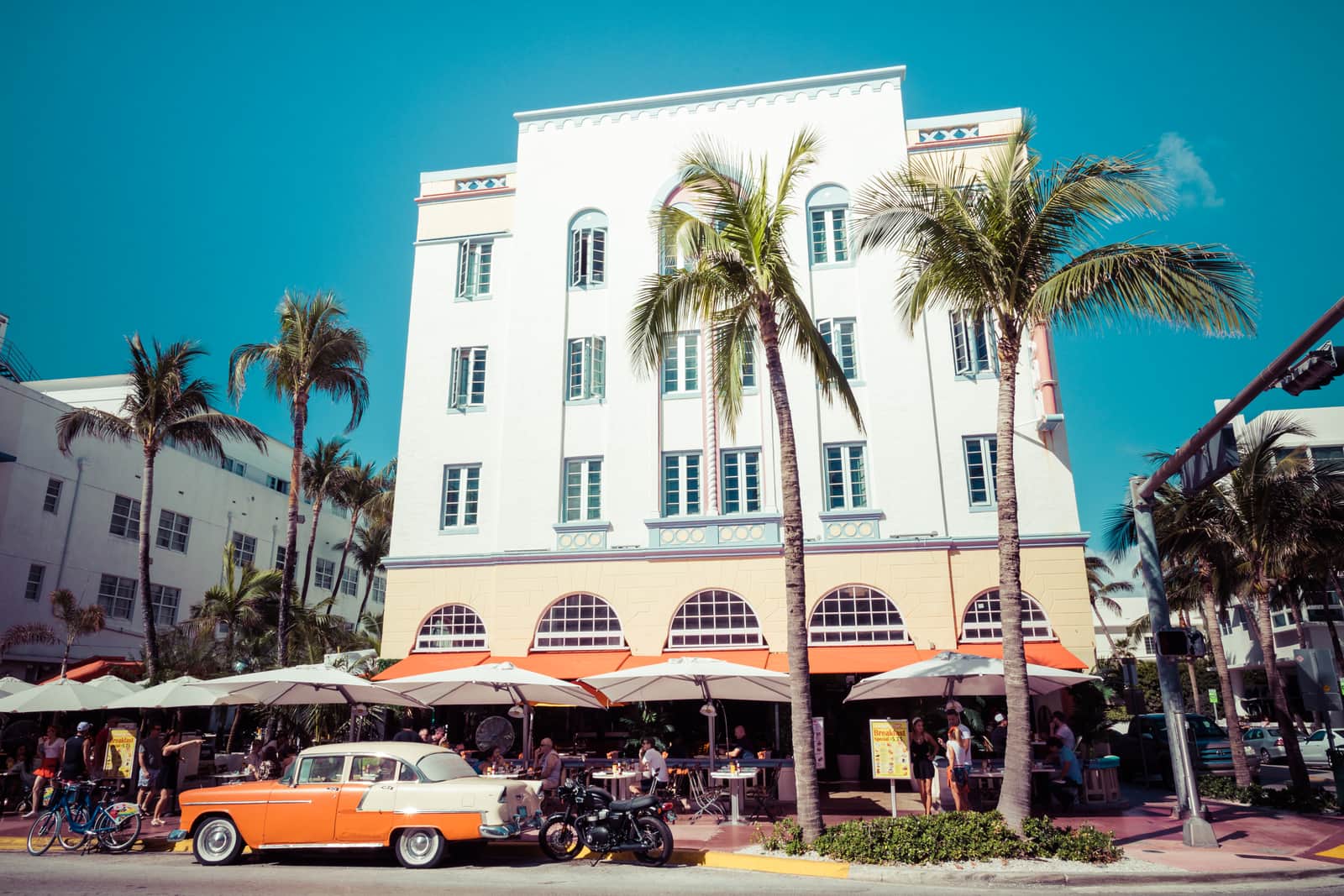 Vintage car parked along Ocean Drive in the famous Art Deco district in South Beach, Florida